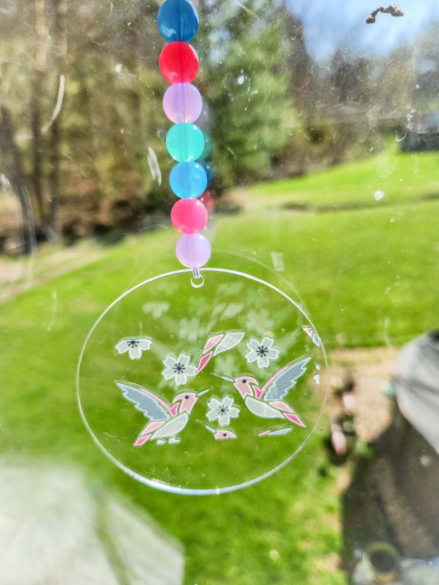 Hummingbirds take flight car charm